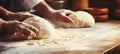 Skilled baker kneading dough in bakery bright photo with copy space for text placement