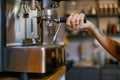 A skilled barista is preparing a rich espresso using a highquality professional coffee machine Royalty Free Stock Photo