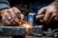 Skilled blacksmith shaping metal with hammer and chisel in workshop during daytime Royalty Free Stock Photo