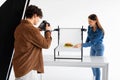Food photographer captures burger with assistant styling Royalty Free Stock Photo