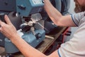 Locksmith cutting key with his machine