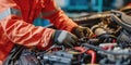 Skilled Mechanic Carefully Servicing Vehicles Electrical System At Auto Repair Workshop