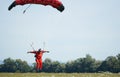 A parachutist jumps at the moment of landing shot