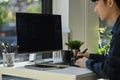 Skilled programmer working on web site project in a software developing on desktop computer at modern office Royalty Free Stock Photo