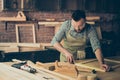 Skilled talented bearded busy confident bearded handyman clothed