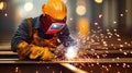 A skilled welder in protective gear creating sparks while working on a steel beam in a workshop environment Royalty Free Stock Photo