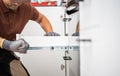 Skilled Worker Assembling Kitchen Cabinet Drawers in Modern Kitchen Royalty Free Stock Photo
