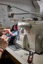 Skilled Worker Operating an Overlock Sewing Machine Royalty Free Stock Photo
