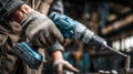 Cordless drill in action as a skilled worker operates it in a workshop, showcasing craftsmanship and precision in a dynamic Royalty Free Stock Photo