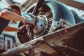 Skilled young airplane mechanic plane check engine avionics hangar industry technology experienced engineer safety Royalty Free Stock Photo