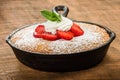 Skillet baked yellow cake with berries