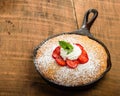 Skillet baked yellow cake with berries