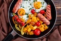 Skillet with maple glazed pumpkin, eggs, sausages