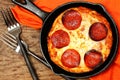 Skillet Peperoni Pizza on Table Royalty Free Stock Photo