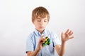 Skillful boy showing fidgeting tricks with four fidget spinners