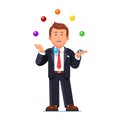 Skillful business man juggling colorful balls