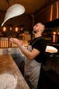 Chef tossing pizza dough for a thin Royalty Free Stock Photo