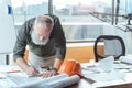 Skillful senior engineer is working enthusiastically Royalty Free Stock Photo