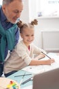 Skillful small child is painting with grandparent Royalty Free Stock Photo