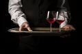 Skillful Waiter hands wine tray. Generate Ai
