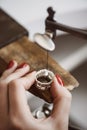 Skillful work. Close up of a female jeweler`s hand working on a ring resizing at her workbench. Ring Resizing. Royalty Free Stock Photo