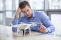 Skillful young guy is designing new drone Royalty Free Stock Photo