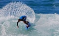 Skim Boarder riding a shore break wave at Aliso Beach in Laguna Beach, California. Royalty Free Stock Photo