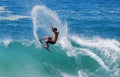 Skim Boarder riding a shore break wave at Aliso Beach in Laguna Beach, California. Royalty Free Stock Photo