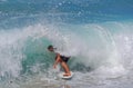 Skim Boarder riding a shore break wave at Aliso Beach in Laguna Beach, California. Royalty Free Stock Photo