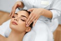 Skin, Body Care. Woman Getting Beauty Spa Face Massage. Treatment. Royalty Free Stock Photo