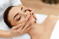 Skin, Body Care. Woman Getting Beauty Spa Face Massage. Treatment. Royalty Free Stock Photo