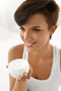 Skin Care. Beautiful Happy Woman Holding Face Cream, Lotion Royalty Free Stock Photo