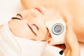 Skin Care. Beautiful Healthy Woman Getting Her Skin Analized By Cosmetologist, Using Skin Analyzer. Professional Beauty