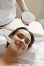 Skin Care. Beautiful Woman Getting Cosmetic Mask At Spa Salon Royalty Free Stock Photo