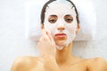 Skin and care. Beautiful Woman Lying With Face Mask. Pure and Beautiful Skin. Young Woman Makes a Face Mask. Caring for Salon. ?ig