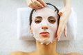 Skin and care. Beautiful Woman Lying With Face Mask. Pure and Beautiful Skin. Young Woman Makes a Face Mask. Caring for Salon. ?ig