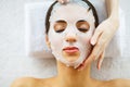 Skin and care. Beautiful Woman Lying With Face Mask. Pure and Beautiful Skin. Young Woman Makes a Face Mask. Caring for Salon. ?ig