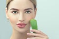 Skin care. Beauty Woman with perfect skin holding fresh leaf of Aloe Vera. Portrait of Beautiful Blonde Spa Girl with perfect skin Royalty Free Stock Photo