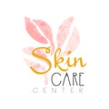 Skin care center delicate logo design. Label with golden and pink gentle colors. Beauty salon emblem concept.