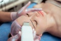 Skin Care. Close-up Of Beautiful Woman Receiving Ultrasound Cavitation Facial Peeling. Ultrasonic Skin Cleansing Procedure. Beauty Royalty Free Stock Photo