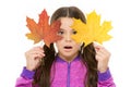 Skin care concept. Fall colors are funny. They are so bright and intense and beautiful. Kid girl hold fallen maple