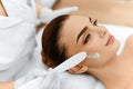 Skin Care. Cosmetic Cream On Woman's Face. Beauty Spa Treatment