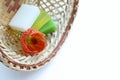 Skin care. Handmade soap and flower closeup in a wicker basket. White background, close-up Royalty Free Stock Photo