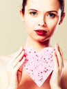 Woman holding pink heart sponge in hands. Royalty Free Stock Photo