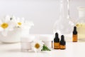 Skin care products, ingredients and laboratory glassware on table. Royalty Free Stock Photo