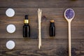 Skin care and relax. Cosmetics and aromatherapy concept. Lavender spa salt and oil on dark wooden background top view Royalty Free Stock Photo