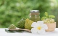 Skin care and spa concept,Thai style with fresh and liquid bergamo ,frangipani  flower and healthy salt on white wood table with Royalty Free Stock Photo