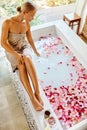 Skin Care Spa Treatment. Woman On Bathtub. Flower Rose Bath. Royalty Free Stock Photo