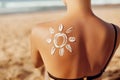 Skin care. Sun protection. Woman apply sun cream. Woman With Suntan Lotion On Beach In Form Of The Sun. Royalty Free Stock Photo