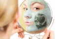 Skin care. Woman in clay mud mask on face. Beauty. Royalty Free Stock Photo